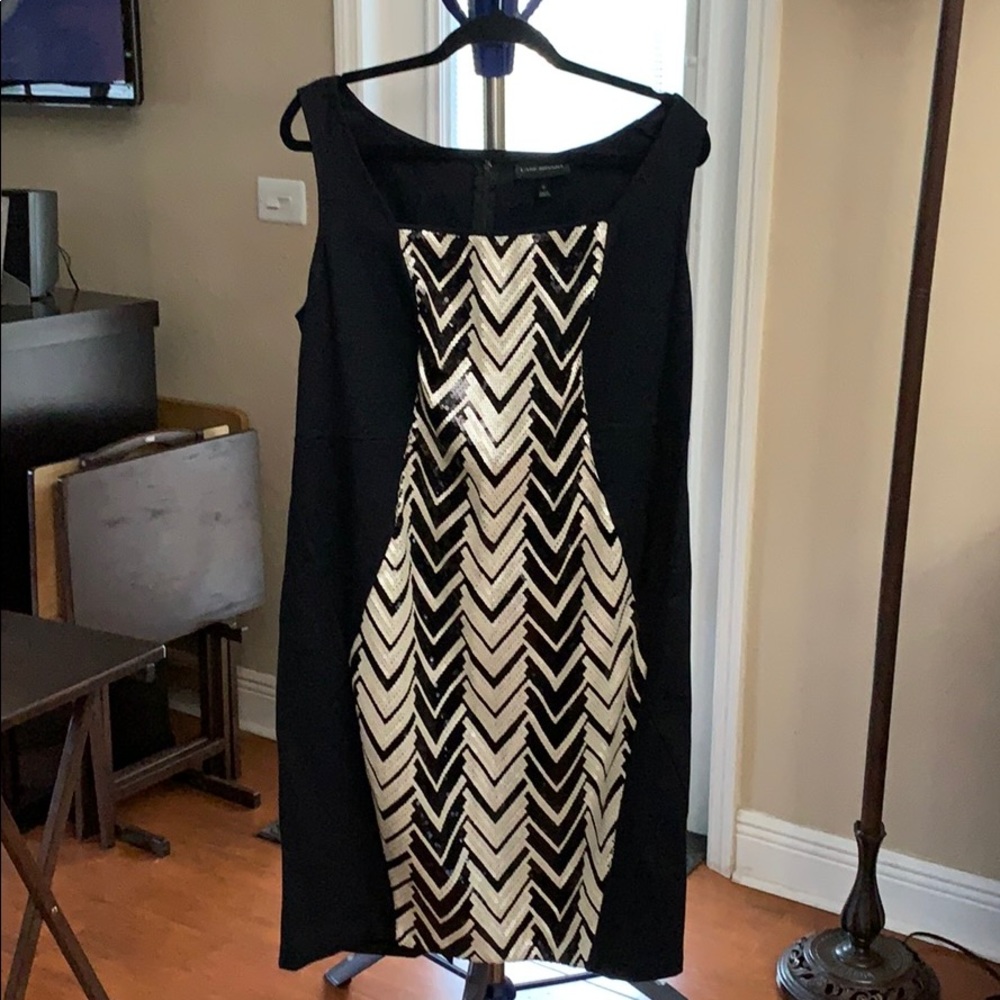 Black sheath dress with black and white sequins.